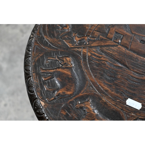 298 - An old carved Indian circular small table, the top with Noah's Ark design, on three turned legs, 42 ... 