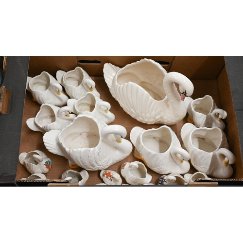 371 - A graduated collection of nine Dartmouth pottery swan-vases to/w ten crested china swans (box)