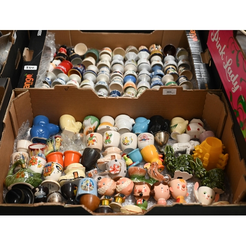 384 - A large collection of over 100 eggcups - ceramic, wooden, etc (2 boxes)