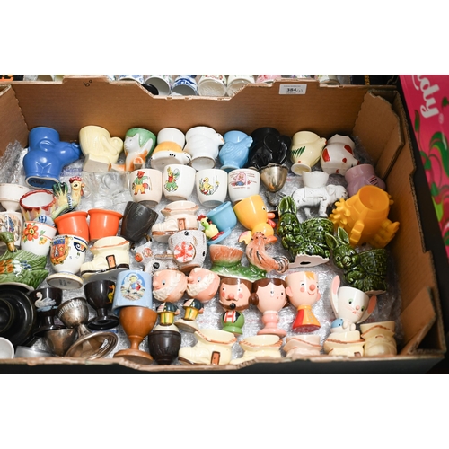 384 - A large collection of over 100 eggcups - ceramic, wooden, etc (2 boxes)