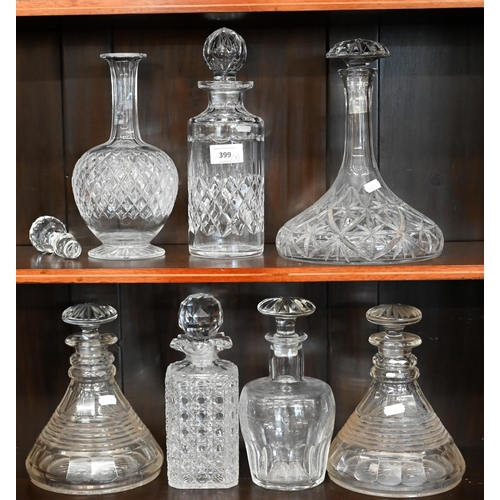 399 - A pair of Georgian style cut glass ship's decanters with mushroom stoppers to/w five other decanters... 