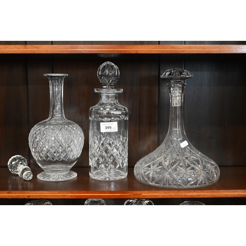 399 - A pair of Georgian style cut glass ship's decanters with mushroom stoppers to/w five other decanters... 