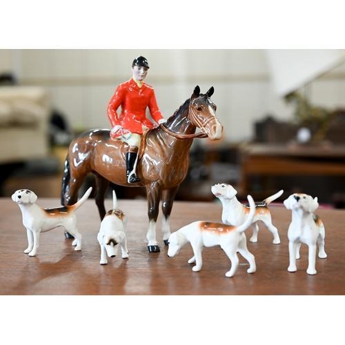 401 - A Beswick huntsman with five hounds