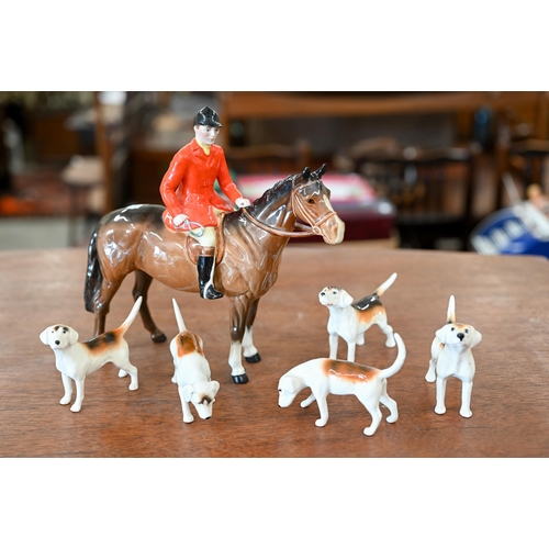 401 - A Beswick huntsman with five hounds