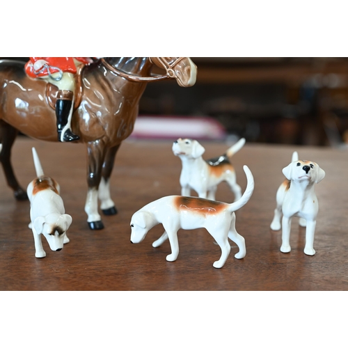 401 - A Beswick huntsman with five hounds