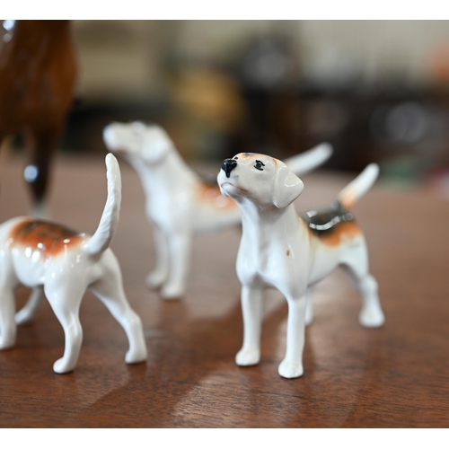 401 - A Beswick huntsman with five hounds