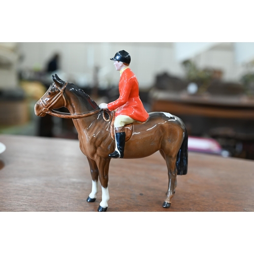 401 - A Beswick huntsman with five hounds