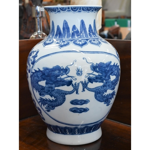 405 - A Chinese blue and white porcelain vase, printed and painted with dragons, 32 cm to/w a hexagonal ta... 