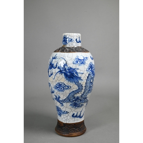 406 - A Chinese blue and white vase painted with dragons on a crackle glaze with incised biscuit bands,27 ... 