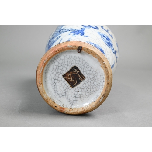 406 - A Chinese blue and white vase painted with dragons on a crackle glaze with incised biscuit bands,27 ... 