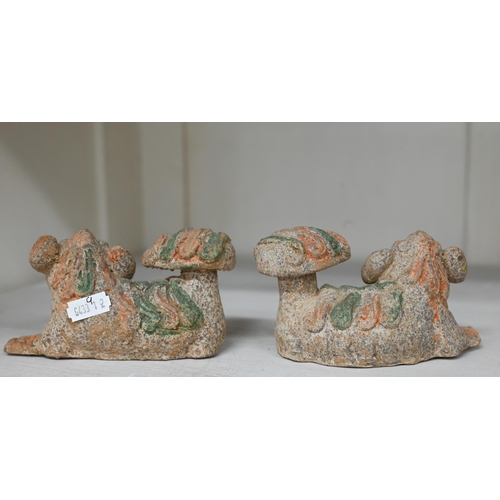 408 - A pair of Chinese earthenware reclining kylin with vestigial painting, 7.5 x 12 cm