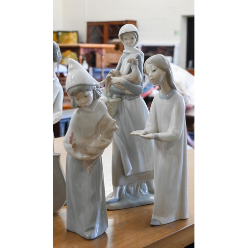 414 - Six Lladro figures and two other Spanish figures (8)