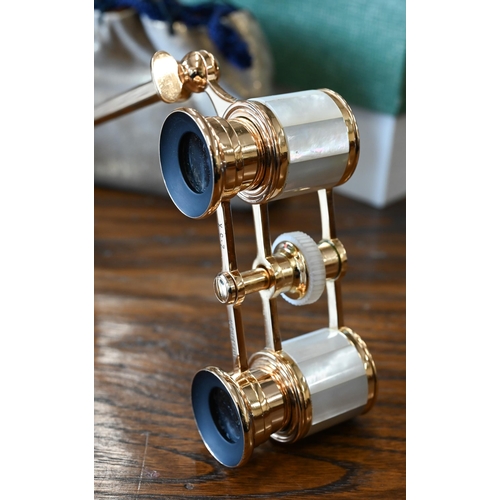 422 - # A boxed pair of gilt metal Mignon 2.5 x opera glasses with mother of pearl mounts, on telescopic c... 