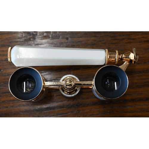 422 - # A boxed pair of gilt metal Mignon 2.5 x opera glasses with mother of pearl mounts, on telescopic c... 