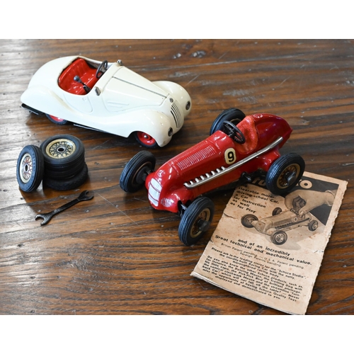 423 - A Schuco Studio clockwork racing car with four spare wheels and accompanying leaflet to/w a Schuco E... 