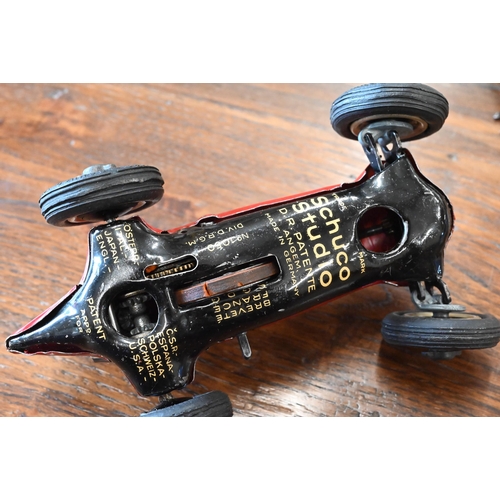 423 - A Schuco Studio clockwork racing car with four spare wheels and accompanying leaflet to/w a Schuco E... 