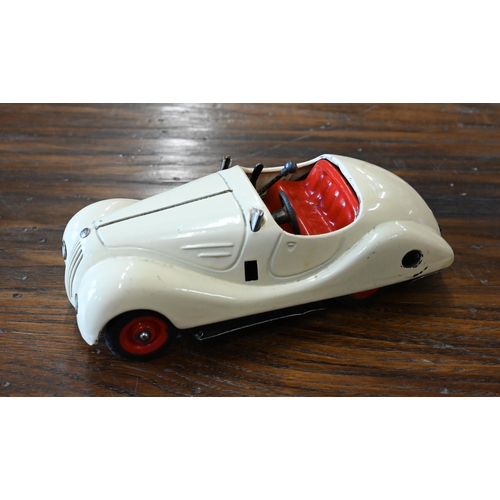 423 - A Schuco Studio clockwork racing car with four spare wheels and accompanying leaflet to/w a Schuco E... 