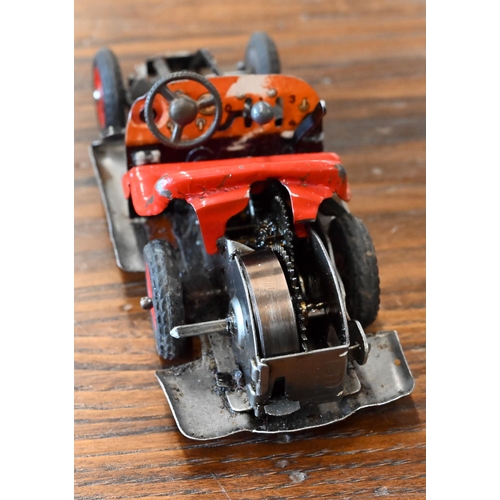 423 - A Schuco Studio clockwork racing car with four spare wheels and accompanying leaflet to/w a Schuco E... 