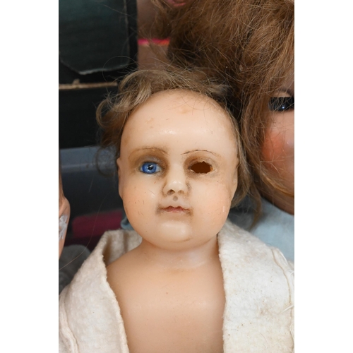 427 - An antique doll with wax head and shoulders and forearms, on stuffed fabric body a/f, to/w a bisque-... 