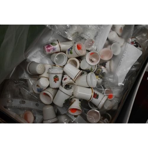 428 - A large collection of china thimbles, commercial scent bottles etc (box)