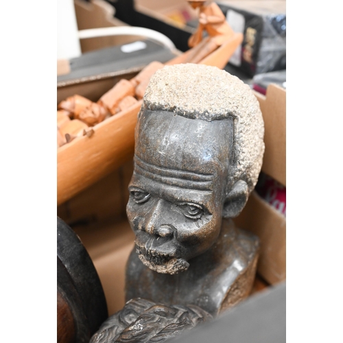 433 - An African carved stone head, to/w various carved wood heads, canoe etc (box)