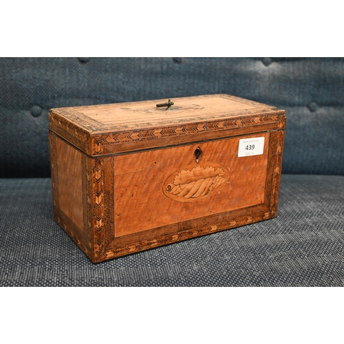 439 - A Sheraton period satinwood tea caddy inlaid with oval shell marquetry medallion and feather banding... 