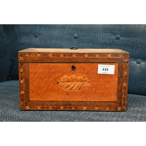 439 - A Sheraton period satinwood tea caddy inlaid with oval shell marquetry medallion and feather banding... 