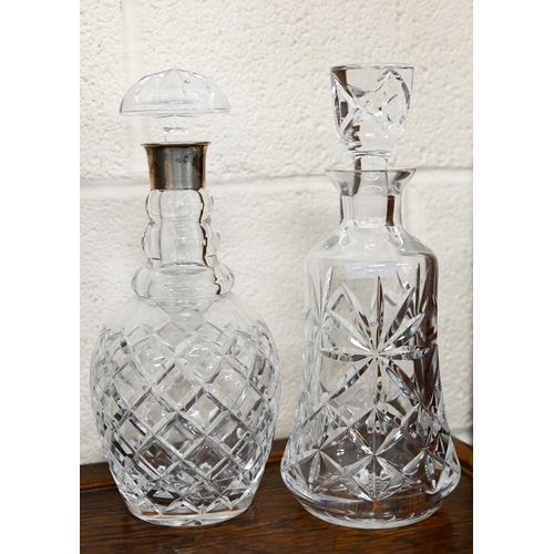 448 - # Two cut glass decanters - one with silver collar (2)