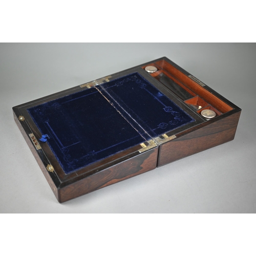 449 - A Victorian rosewood writing slope with blue velvet-lined fitted interior, inlaid overall with brass... 