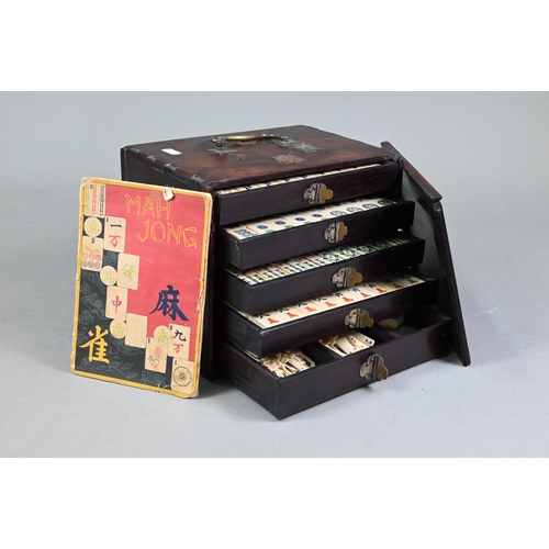 451 - An antique Chinese Mah Jong set with bone and bamboo tiles, in rosewood case with five drawers