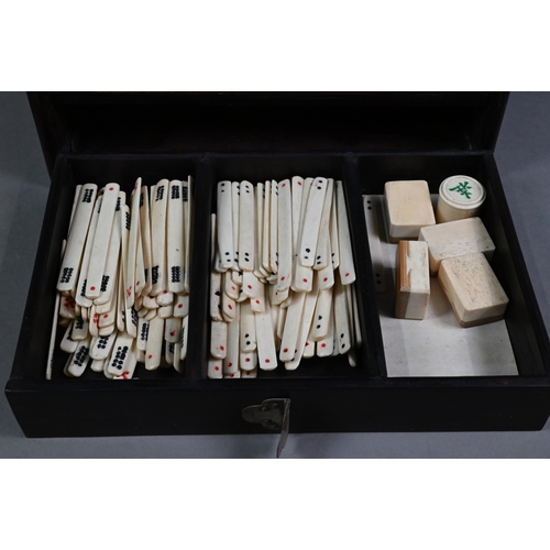 451 - An antique Chinese Mah Jong set with bone and bamboo tiles, in rosewood case with five drawers