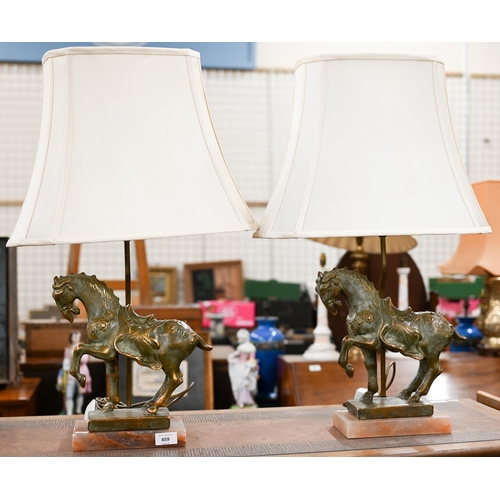 459 - A pair of table lamps mounted with Chinese brass horses on onyx bases (2)