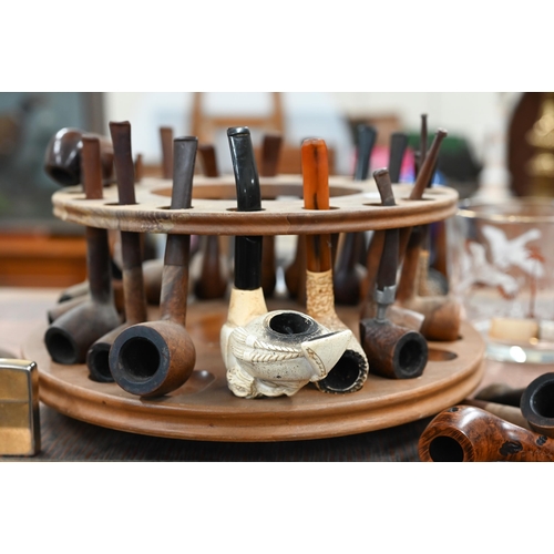 460 - A revolving wooden pipe-rack to/w various pipes, lighters etc