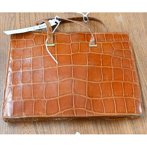 466A - A vintage brown crocodile leather handbag with slender short handles and popper fastener, 22 x 17 cm