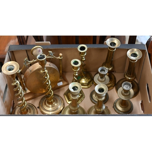 489 - Two pairs of brass open twist candlesticks to/w three pairs of baluster candlesticks and a table-gon... 