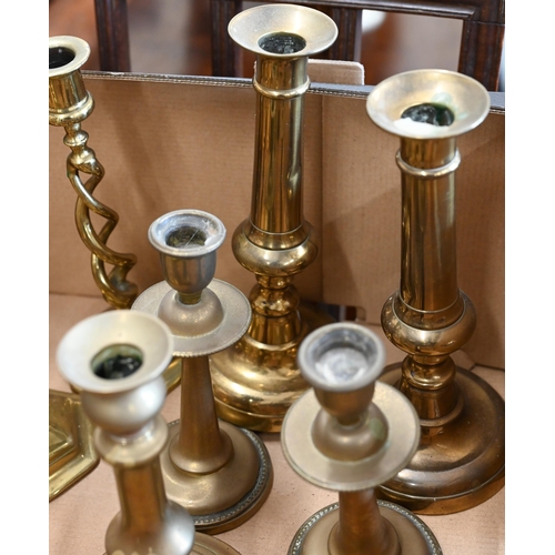 489 - Two pairs of brass open twist candlesticks to/w three pairs of baluster candlesticks and a table-gon... 