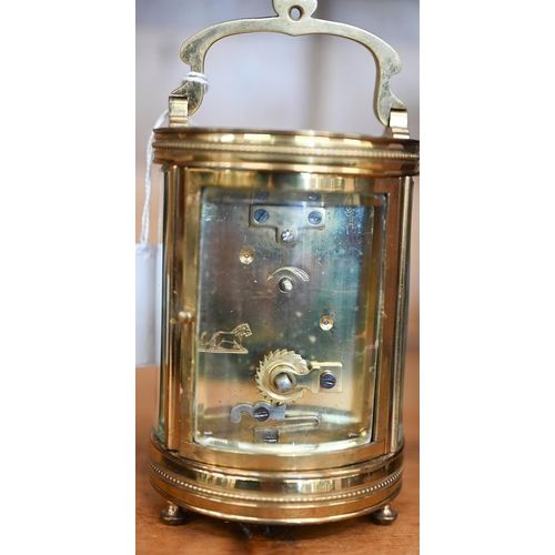 491 - An unusual cylindrical carriage clock with bevelled glass panels (enamel dial a/f), 16 cm overall, i... 