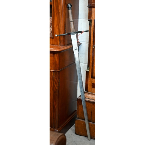 492 - A replica two-handed sword with 105 cm blade, 132 cm overall