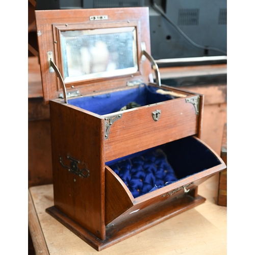 498 - A Victorian brass-mounted walnut jewellery casket with mechanical rising top and fall front to blue ... 