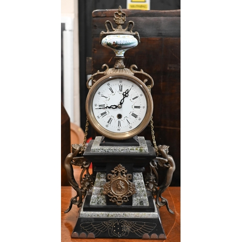 501 - A brass-mounted marble mantel clock with mixed decorative motifs, 42 cm