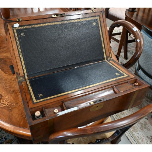 502 - A Victorian brass-bound walnut writing slope with fitted interior and secret compartment, 51 cm wide