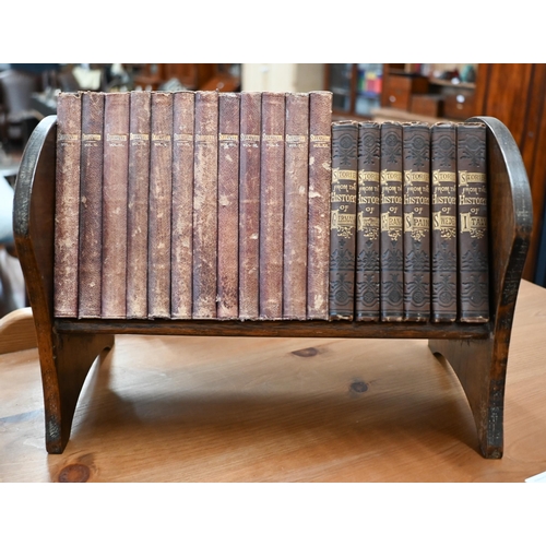 506 - An oak book trough containing twelve volumes of Shakespeare's works 1883-86, in gilt decorative Moro... 