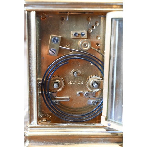 512 - A carriage clock repeat striking on a coiled gong, 15 cm overall