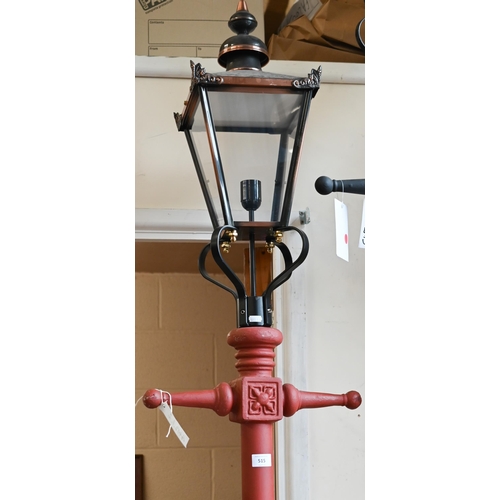 515 - A Victorian-style red cast iron-effect streetlamp post with copper four-glass lantern, approx 240 cm... 