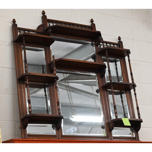 518 - A late 19th century walnut framed over mantel with an arrangement of mirrors and display shelves, 12... 