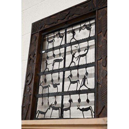 523 - An African style decorative frame with artisan steel panel