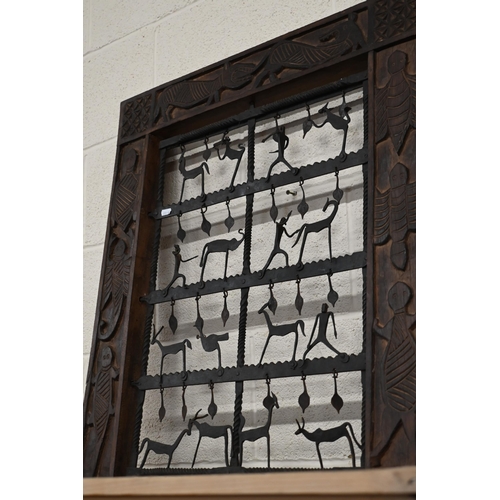 523 - An African style decorative frame with artisan steel panel