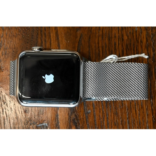 62 - An Apple Series 3 wristwatch, magnetic stainless band, boxed with charge cable, usb plug and booklet... 