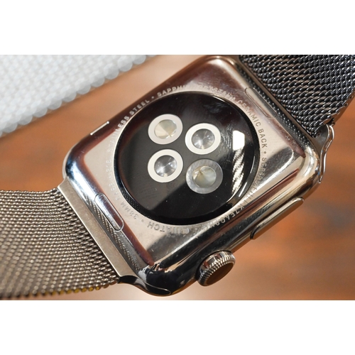 62 - An Apple Series 3 wristwatch, magnetic stainless band, boxed with charge cable, usb plug and booklet... 