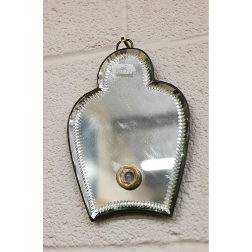 64 - A sorcerer's mirror 61 cm x 30 cm to/w a small mirror back sconce (no sconce arm) 18 cm x 13 cm, bot... 